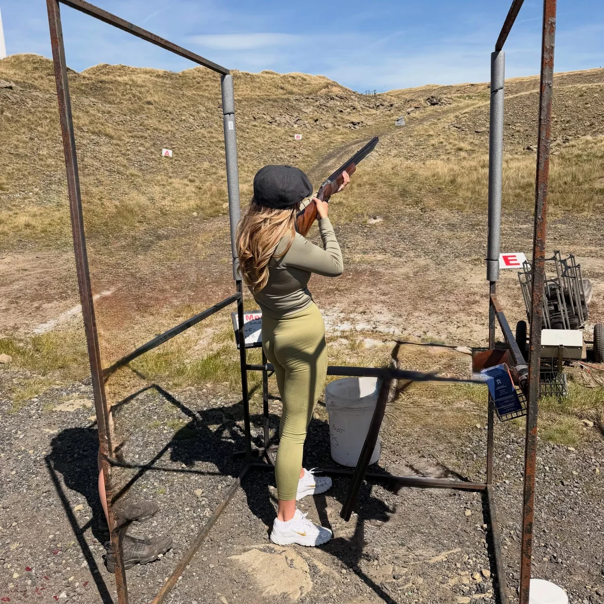 A participant shooting from a stand at Clough Head